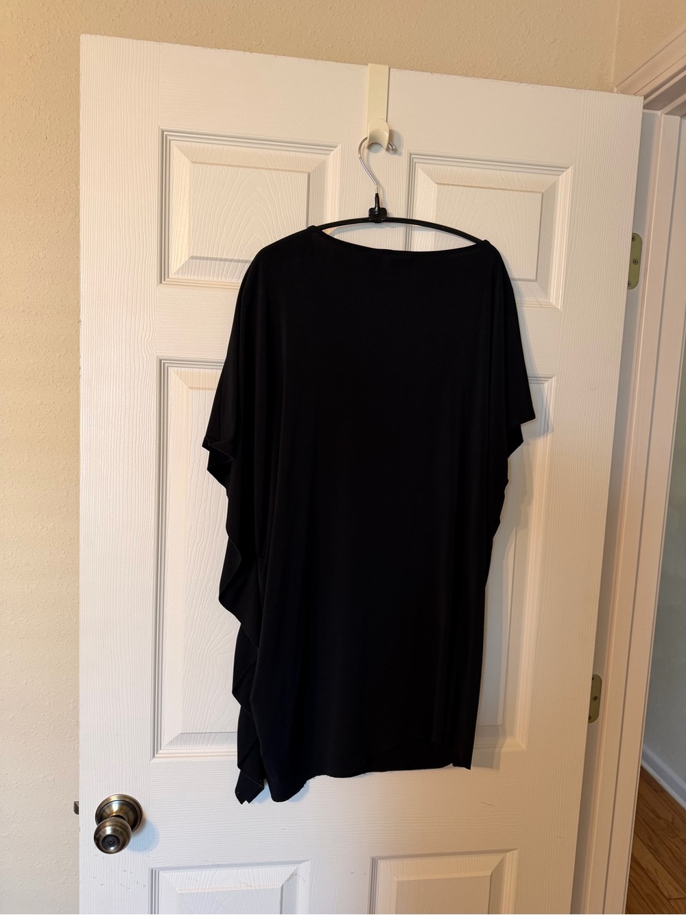 Chico’s Black Women’s sleeveless top with side stitched / draped up.